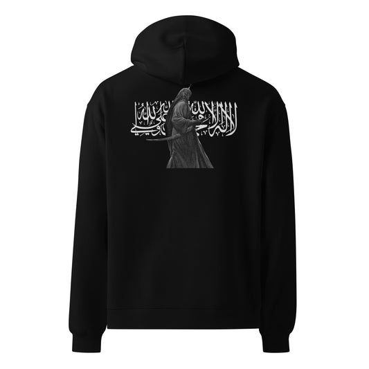 Our Shahada Oversized Hoodie is a bold fusion of sacred calligraphy and historical artistry.
